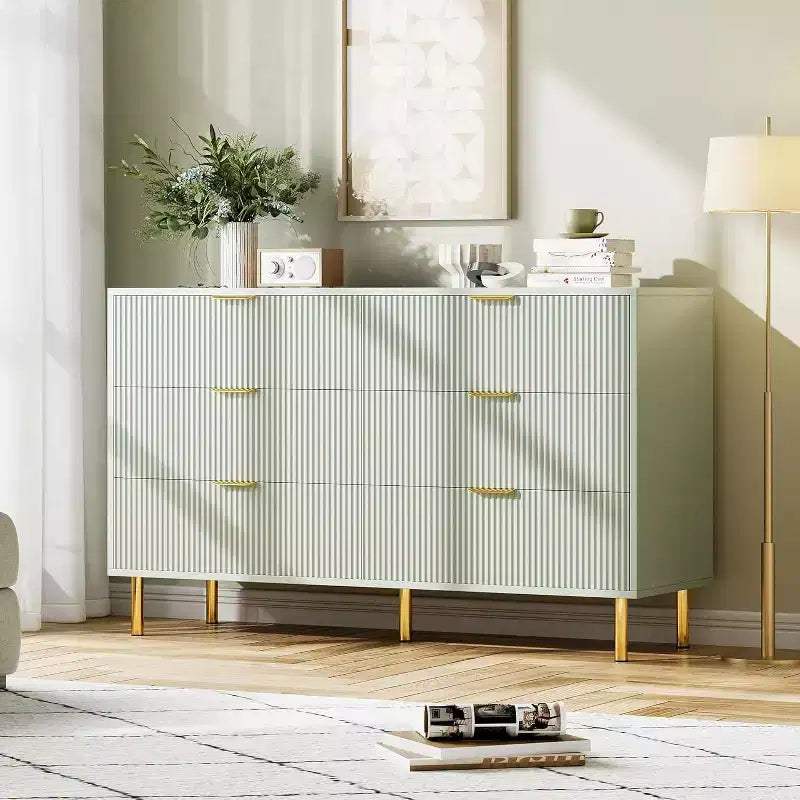Comò a 6 cassetti con maniglie dorate, disponibile nei colori nero, verde grigio opaco e bianco/legno